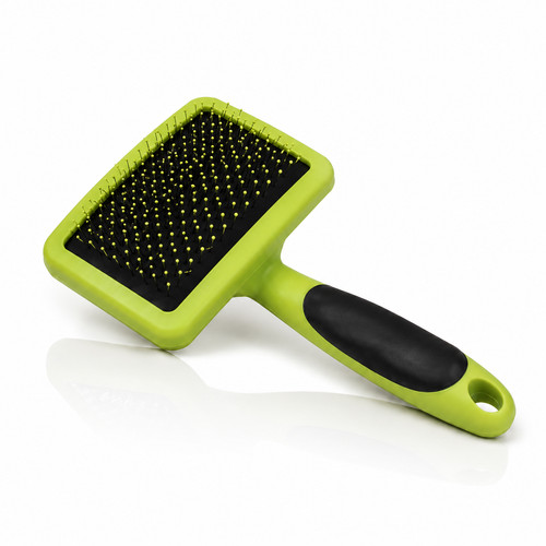 Self-cleaning slicker brush